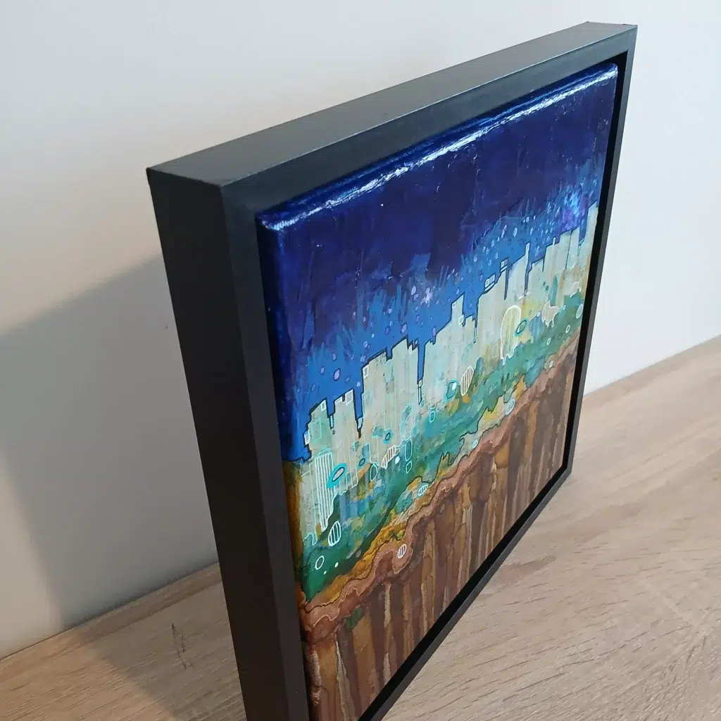 petit tableau urbain ciel atomique 30 cm x 30cm encadré