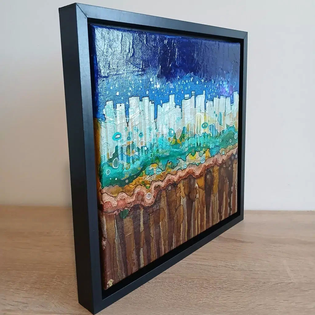 petit tableau urbain ciel atomique 30 cm x 30cm encadré