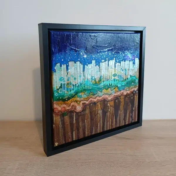 petit tableau urbain ciel atomique 30 cm x 30cm encadré